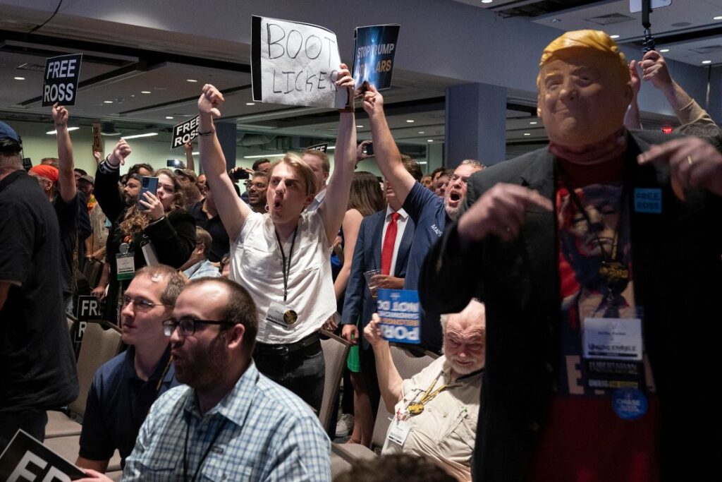 Attendees jeer Trump as he speaks at the Libertarian convention on May 25, 2024. Jose Luis Magana/AP