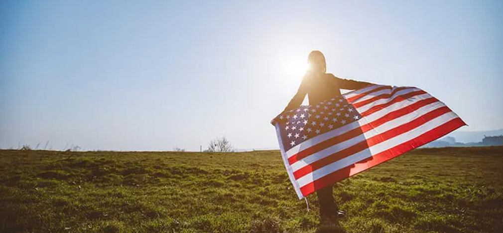 Person holding American Flag